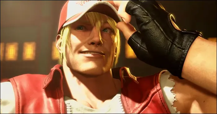 Um screenshot de Terry Bogard em Street Fighter 6, mostrando-o sorrindo e segurando seu boné vermelho característico. A imagem destaca o personagem com detalhes nítidos e gráficos avançados.